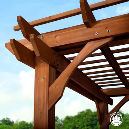 Wooden pergola structure with a clear blue sky and green trees in the background